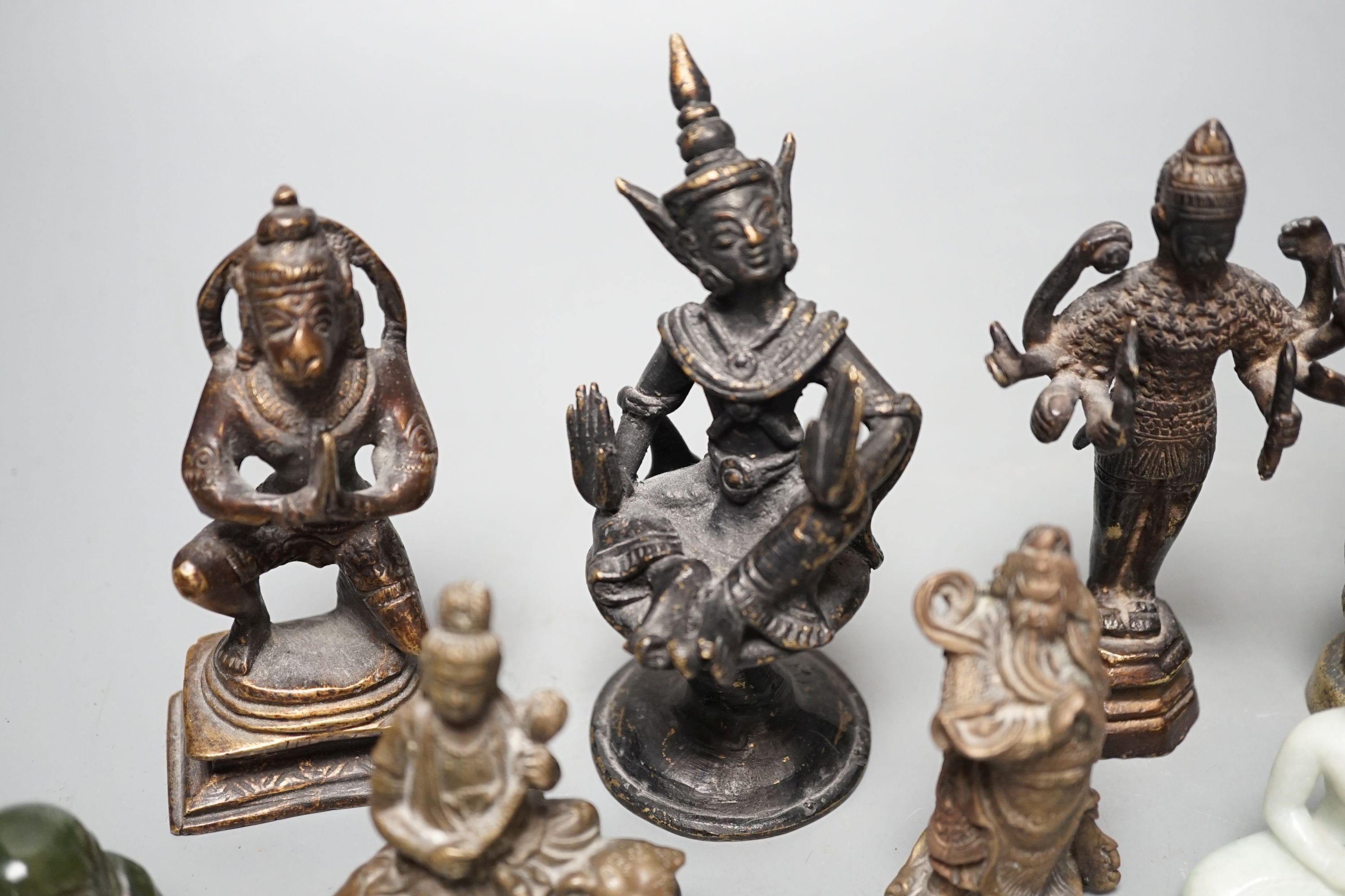 A quantity of Indian and South East Asian bronze and brass models of deities etc.